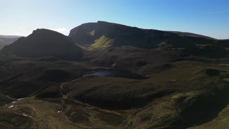 Pan-across-the-Quiraing-rock-formation-with-Loch-Cleat-at-the-Trotternish-Ridge-Isle-of-Skye-Scotland