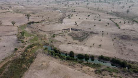 Drone-shot-of-a-small-lake-in-the-desert-of-Senegal