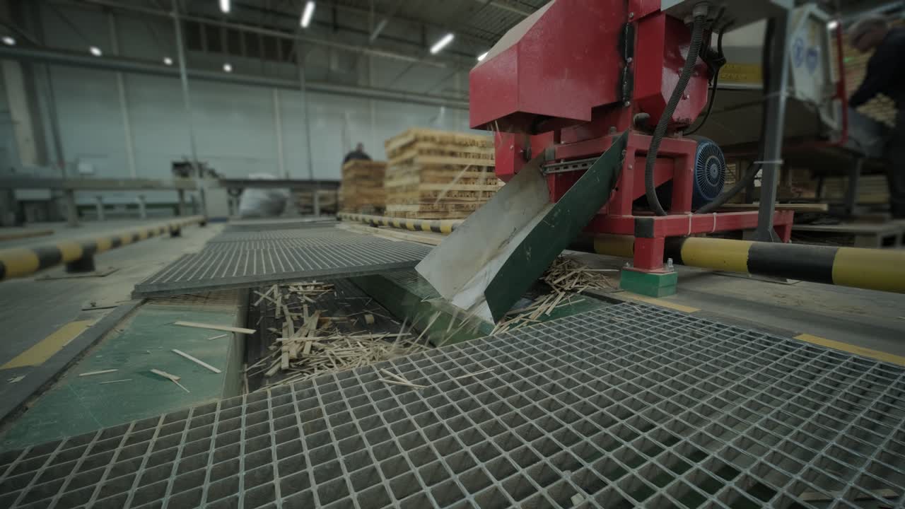 Industrial Wood Chipper Shredding Wood Waste in a Factory