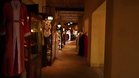 a bustling market with various clothing displays