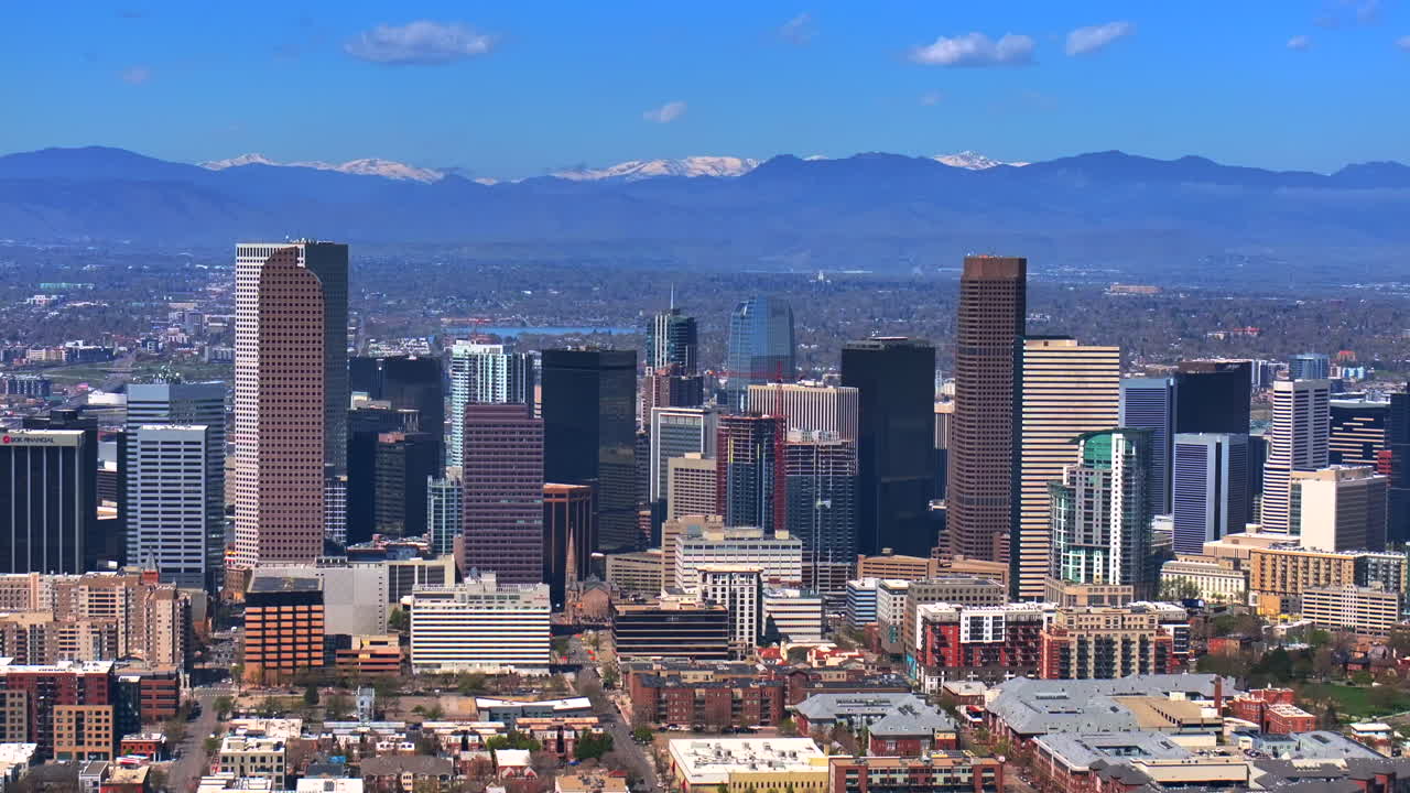 Indian Peaks City Park Lodo Downtown Denver Cityscape Landscape Colorado aerial drone view tall skyscraper buildings city living apartments spring summer front range mountains parallax upwards