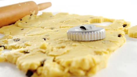 Rolling-pin-and-cookie-cutter-on-dough