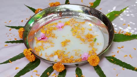 milk water kept at decorated bath tub for holy first bath for newborn indian baby at home