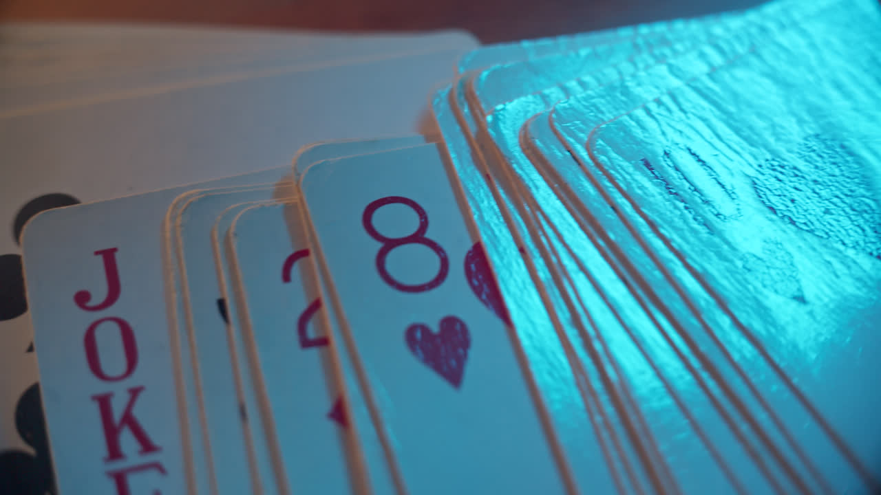 Close-up of playing cards with blue light