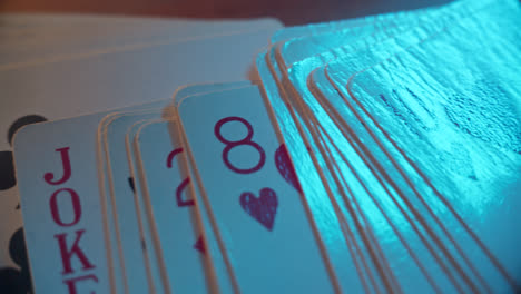 close-up of playing cards with blue light