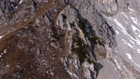 Aerial-tilt-up-revealing-Nordkette-mountain-nature-park,-Innsbruck