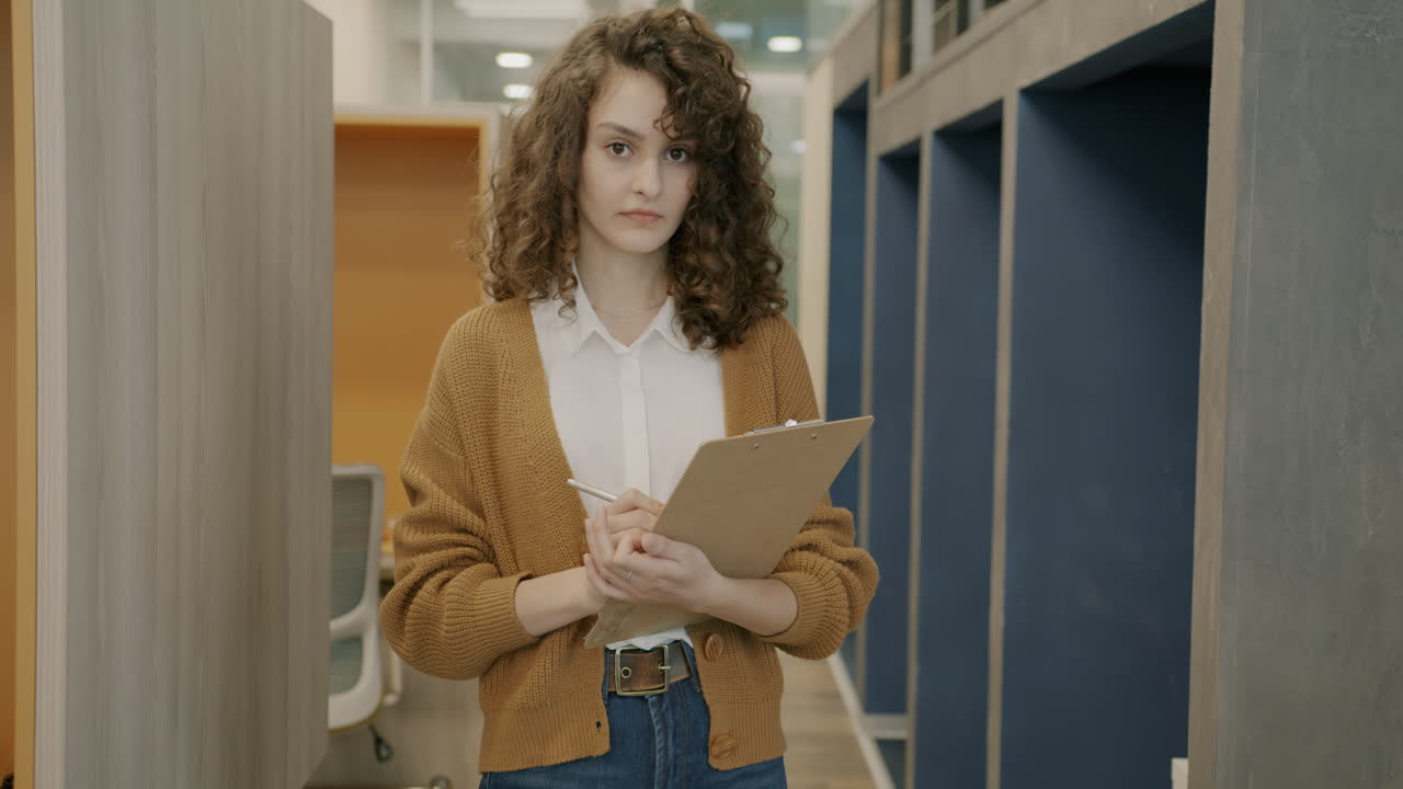 Woman taking notes in a modern office