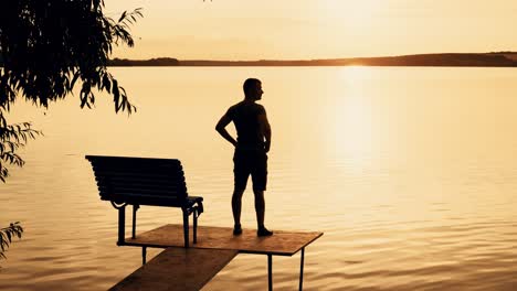 a man was standing on the bridge and than sat down on a bench to looking at the beauty of nature on the background of the river and the sunset on a summer evening.