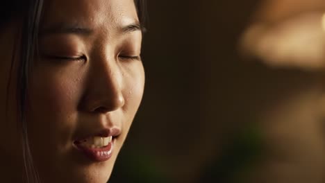 an intimate glimpse of serenity and reflection captured in close-up: a moment of stillness with expressive features highlighting emotion and calmness
