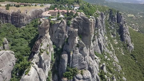 Medieval-monastery-perched-atop-steep-rock-cliffs,-Meteora-Greece