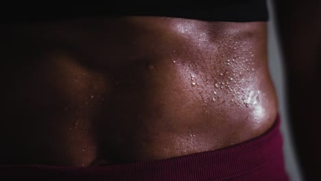 Close-Up-Shot-Of-Beads-Of-Sweat-On-Woman-Wearing-Gym-Fitness-Clothing-Exercising-2