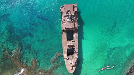 amazing aerial view flight in turquoise green sea shipwreck on beach sandbank lanzarote canary islands, sunny day spain 2023