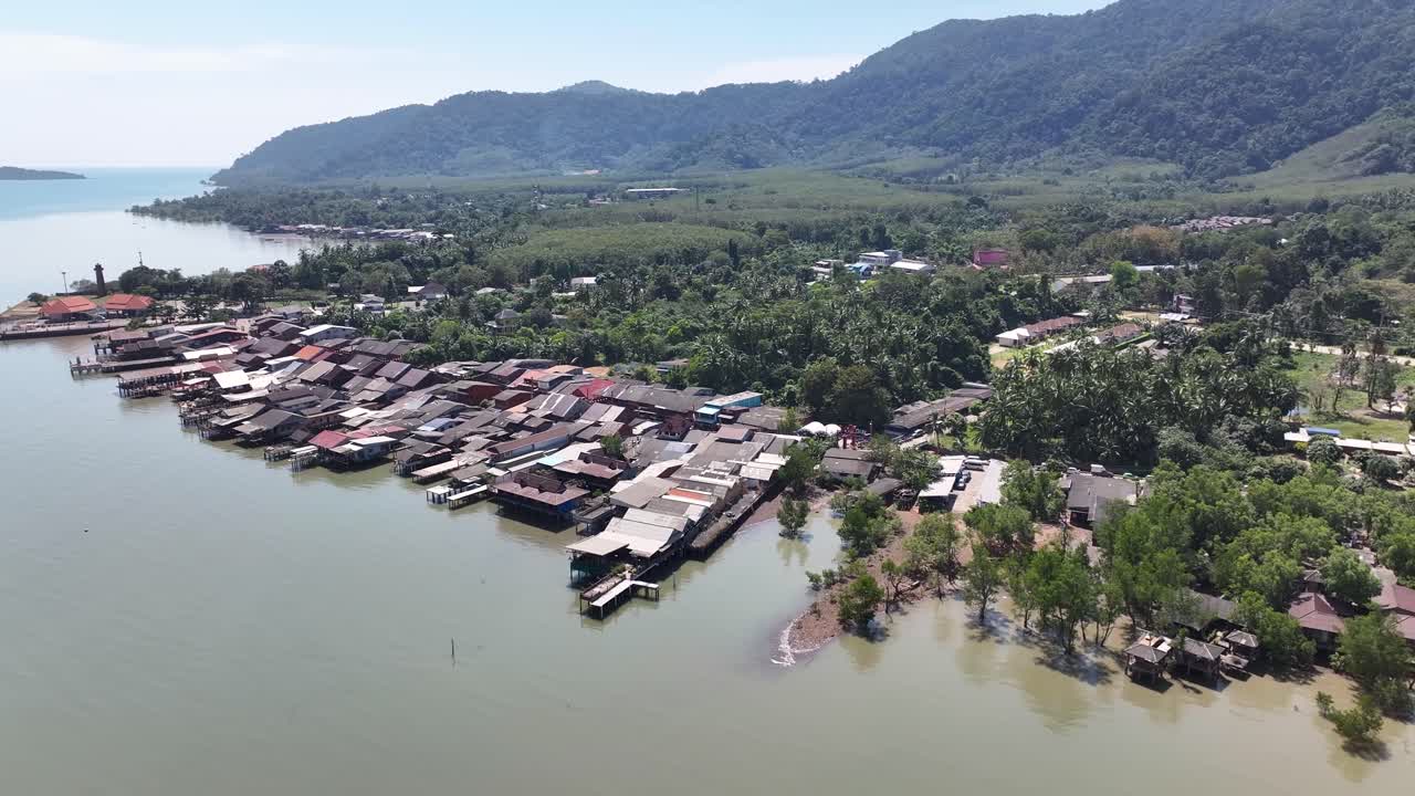 Koh Lanta old town, village buildings on water, seaside Thailand. Beautiful sunny day. Aerial drone