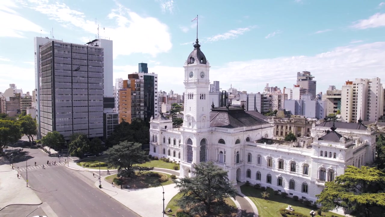 4K drone aerial view of La Plata City Hall in Buenos Aires, Argentina. Historic municipal building overlooking Plaza Moreno, featuring distinctive European-inspired architecture in the city center.