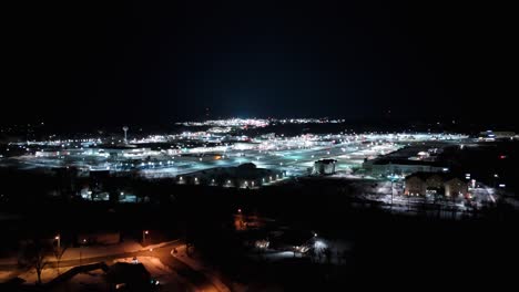 aerial close up of the millcreek mall at night in the winter in erie, pa.