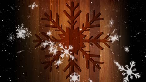 snow falling and wooden snowflake shape