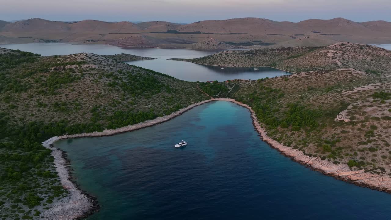 Aerial right pan of the islands in the Kormati region on a sunny day in Croatia.