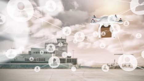 animation of connected icons, drone carrying cardboard box, building and airplane against cloudy sky