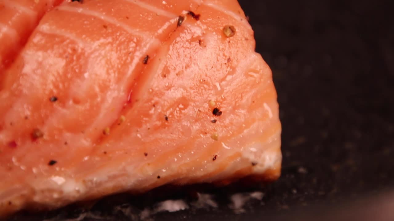 Raw fresh tasty salmon steak placed on pan with ingredients. Salmon steak in a grill pan. Baked salmon fillet. Salmon fish in a pan