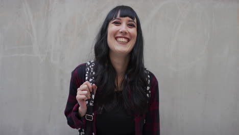 portrait happy young caucasian woman smiling cheerful looking at camera wearing nose ring slow motion