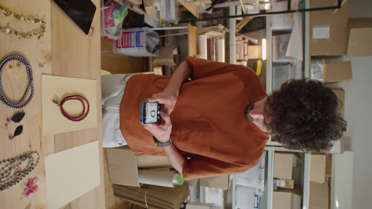 Man Taking Photos of Necklaces in Online Store Warehouse