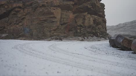 Vehicle-tracks-in-fresh-snow-in-northern-town