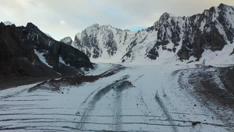 Aerial-epic-drone-shot-of-the-slope-down-the-Ak-Sai-glacier-in-Kyrgyzstan