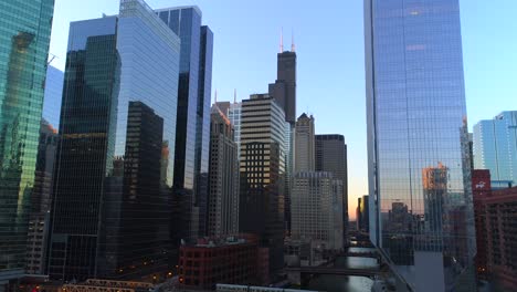 aerial chicago illinois cinematic conclusion shot pull back train skyscrapers urban