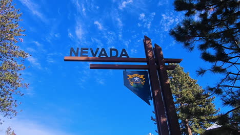 nevada state border sign, driving from california in lake tahoe area usa