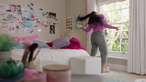 happy overweight teenage girl dancing in bedroom having fun dance celebrating weekend feeling positive wearing pajamas at home