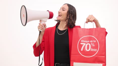 woman with megaphone and shopping bag announcing a sale