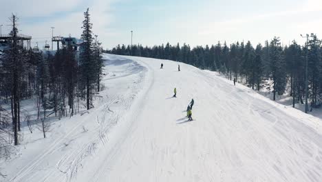 skiers on a snowy mountain slope