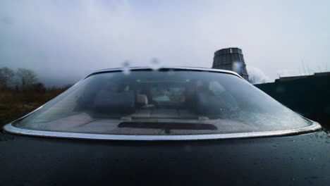 black car with rear window and rain