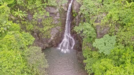 scenic aerial view of lumondo waterfalls with a tilt up perspective in surigao del norte, philippines