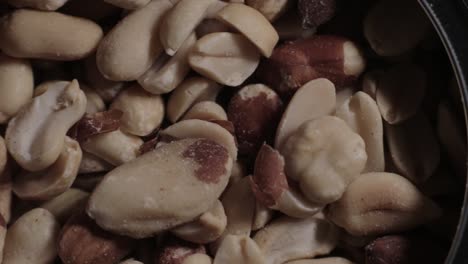 canned mixed cracked healthy nuts - close up shot