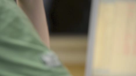 close-up of a person's hand using a computer mouse