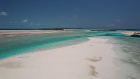 paradise beach turquoise ocean with white sand - aerial drone shot