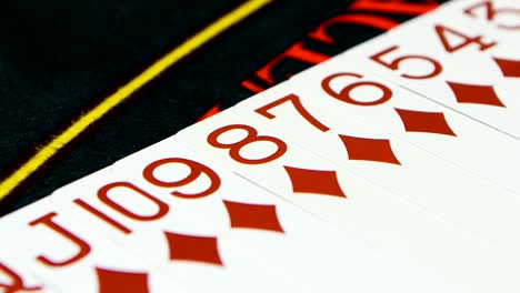 close-up of playing cards on a casino table