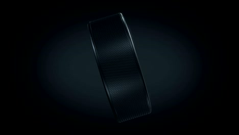 beautiful hockey puck turning on black background in looped 3d animation with green screen alpha mask. active sport concept.