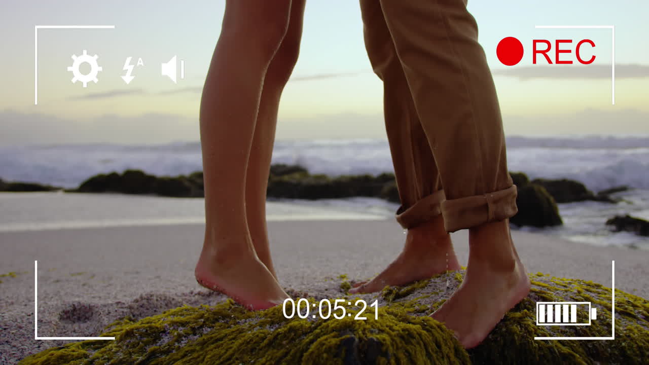 Filming a couple on a beach on a digital camera 4k
