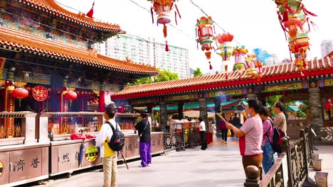 people exploring the vibrant temple in hong kong