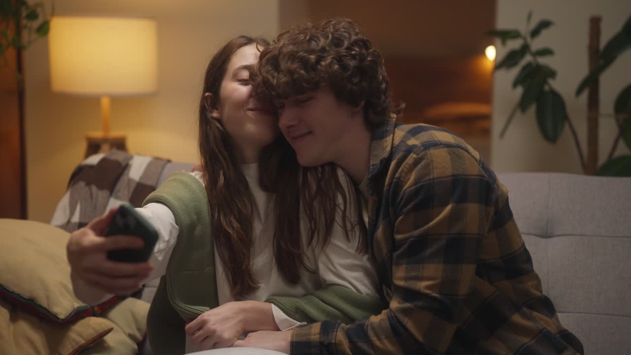 Couple Taking a Selfie at Home