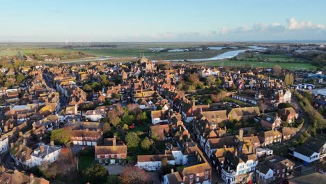 Sunset-over-Rye-town-centre-Sussex-UK-pull-back-drone-aerial-reverse-reveal