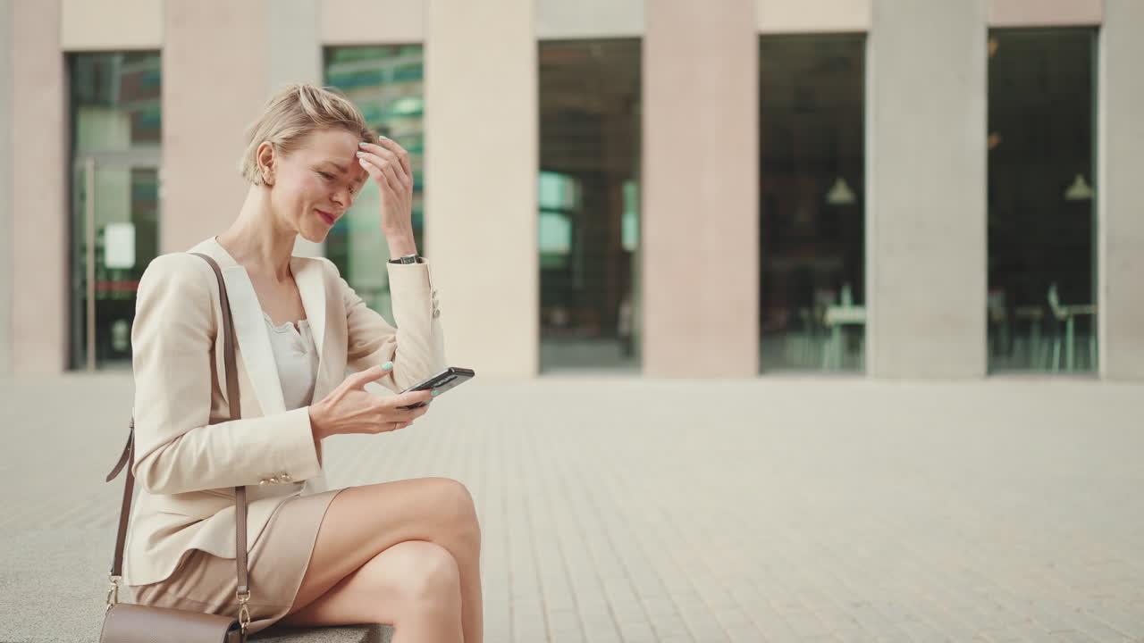 Businesswoman using mobile phone outdoor