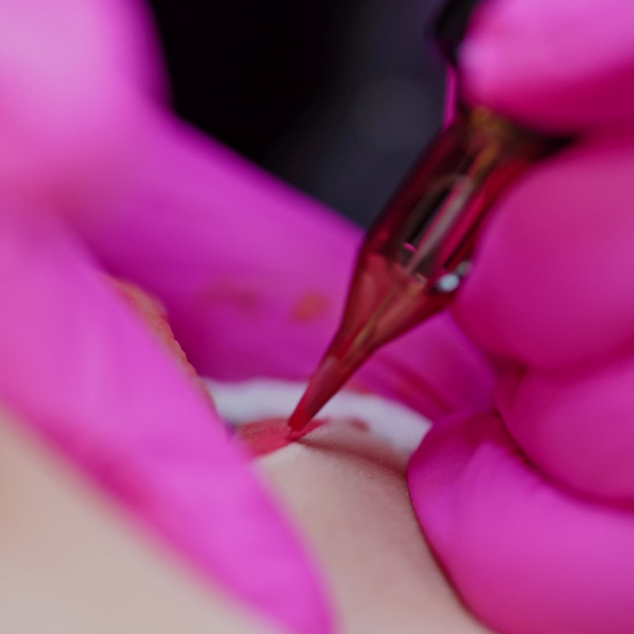 Cosmetologist applying permanent make up