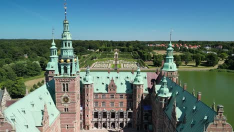 frederiksborg castle flyover toward gardens drone