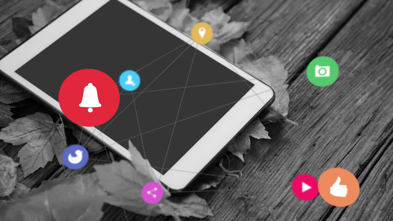 Animation of media icons over tablet and leaves