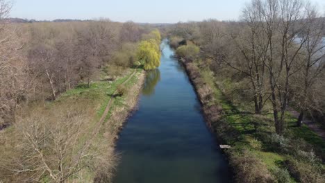 Flying-low-over-the-River-Great-Stour-among-the-trees-near-Fordwich,-England