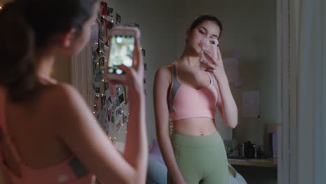 happy-teenage-girl-taking-selfie-photo-using-smartphone-posing-in-mirror-sharing-stylish-fashion-on-social-media-enjoying-weekend-at-home-teen-self-image