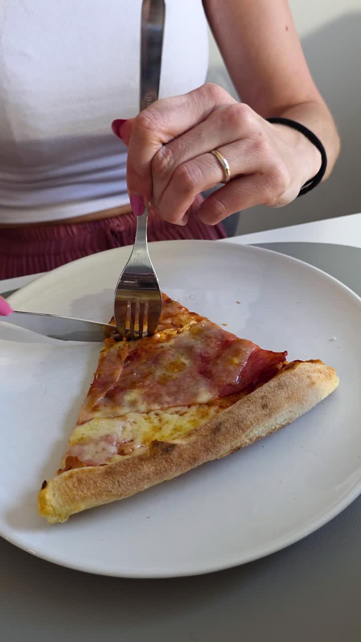 Eating pizza slice with fork and knife, italian dish cuisine fine dining